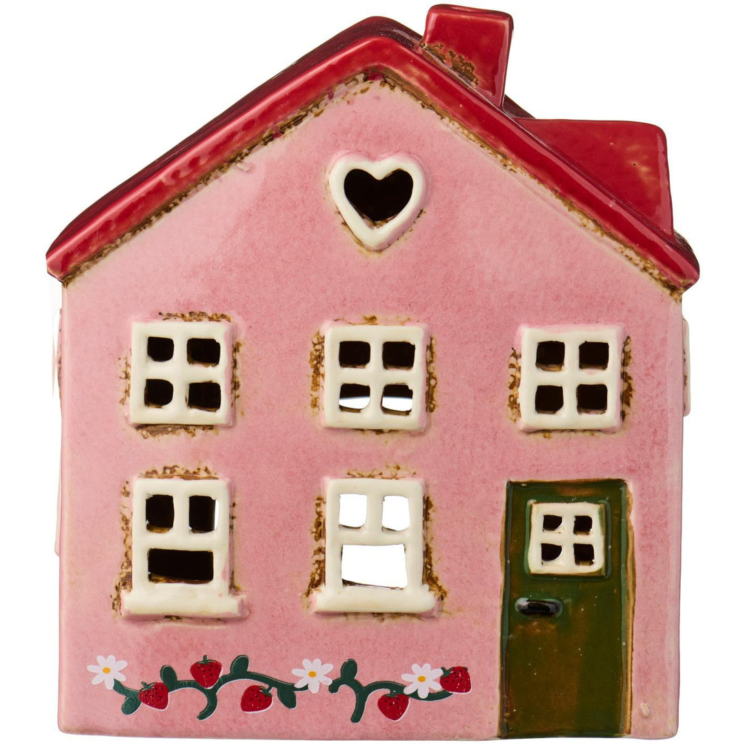 Casa de cerámica rosa con flores